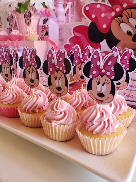 Pink Minnie Mouse birthday party | CatchMyParty.com Minnie Pink Birthday Party, Minnie Mouse Cupcakes 2nd Birthday, Minnie Mouse Outside Party Ideas, Minnie Mouse Sweet Table, Mimmie Mouse Birthday, Mini Themed Birthday Party, Minnie Mouse Party Desserts, Birthday Decorations Minnie Mouse, Minnie Mouse Cake Birthday