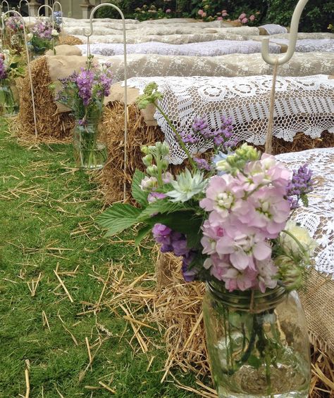 Country wedding with hay bale seating & jam jar flowers on shepherds crooks Hay Bale Ideas, Hay Bale Wedding, Jam Jar Flowers, Hay Bale Seating, Seating Wedding, Wedding Ceremony Seating, Rustic Wedding Ideas, Rustic Wedding Seating, Barn Wedding Decorations