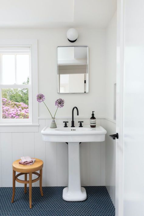 Tour a classic farmhouse renovation with beautiful details on Long Island Elizabeth Roberts, Plush Furniture, Farmhouse Renovation, Pedestal Sink, White Cottage, Historic District, House Roof, Best Interior Design, Farmhouse Bathroom