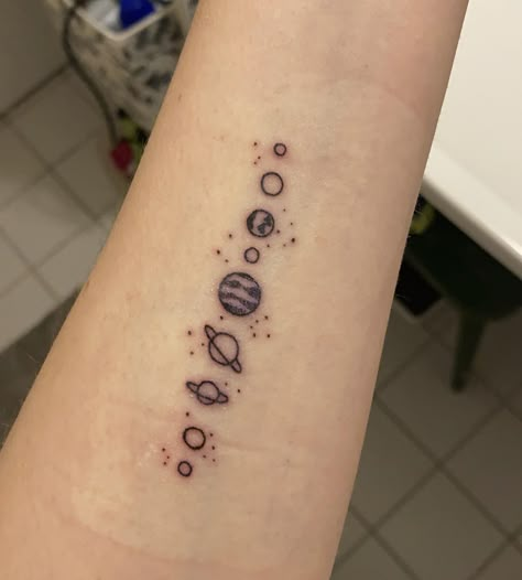 Minimalist Tattoo Solar System, Solar System Tattoo Forearm, Solar System Finger Tattoo, Dainty Solar System Tattoo, Astronomy Tattoo Ideas, Planets Tattoo Simple, Solar System Tattoo Minimalist, Iceland Tattoo, Wrist Tatoo