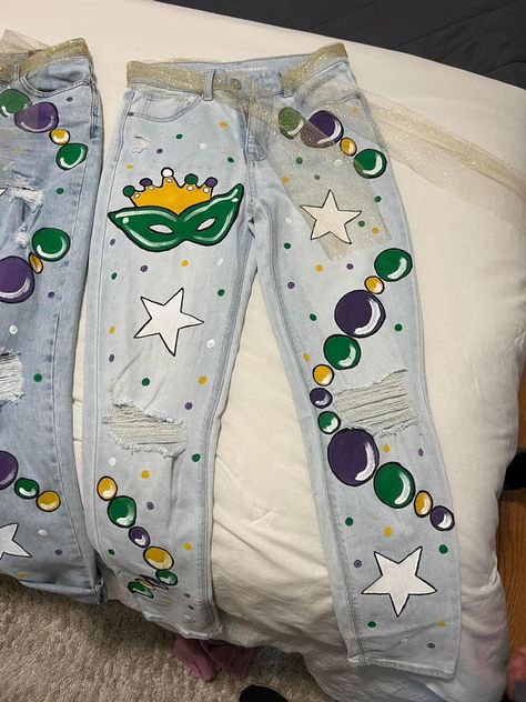 Mardi Gras Pants Painted, Mardi Gras Blue Jean Jacket, Mardi Gras Jacket Diy, Painted Mardi Gras Jacket, Diy Mardi Gras Shirt, Diy Mardi Gras Pants, Mardi Gras Denim Jacket, Mardi Gras Jean Jacket Painted, Mardi Gras Pants Diy Cajun