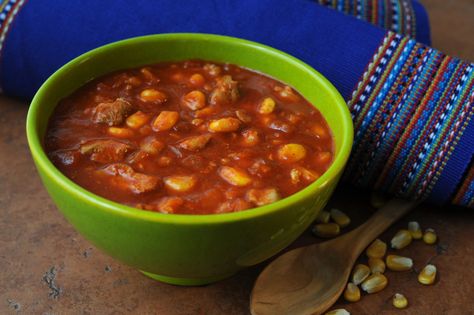 Traditional Red Chile Posole is a hearty stew made with hominy, pork and red chile. It's often the centerpiece of winter holiday gatherings in New Mexico. Hominy Stew, Pork Posole, Mexico Recipes, Posole Recipe, Southwest Recipes, Hearty Stew, Smokey Mountain, Lean Pork, Mexican Kitchens