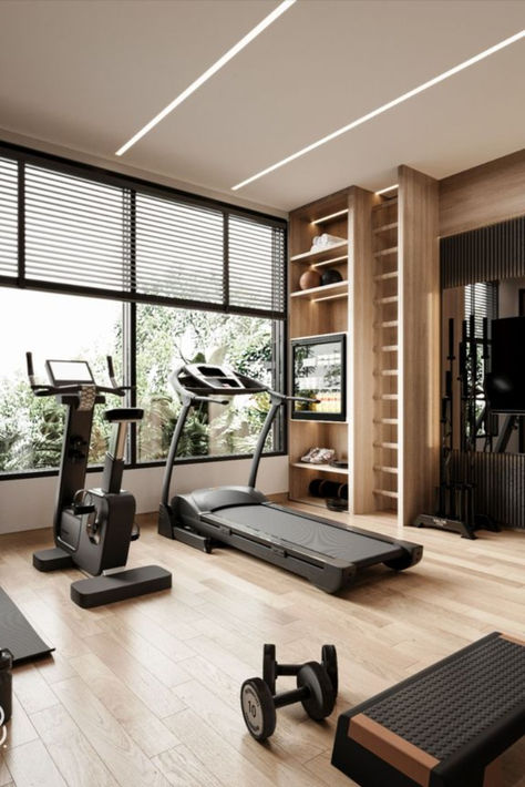 Home gyms don't need to be bleak. Workout equipment that’s been relegated to your basement or tucked into a garage corner can still look really good with the help of a little paint, wallpaper, good lighting, and a few plants, you can totally transform the space you break a sweat in. Home Gym Interior Design Nails Moody Farmhouse Modern Farmhouse Rutic Decor Home Inspo Yoga Trends Yoga Poses Fitness Studio Ideas home wallpaper home decor bedroom home decorating nails home interior design home Interior Design Gym Room, Home Gym Loft, Gym Rooms In Houses, Fitness Room Ideas Home Gyms House, Private Fitness Studio, Home Gym Asethic, Home Gym Studio Ideas, Home Gym Room Design, Kardashian Gym Room