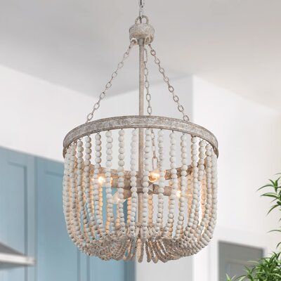 Fresh Air and open frame 4-light ambient lanterns chandelier harmonize weathered hand-painted wooden beads, and distressed gray finish together to form a lovely drum-shaped openwork shade that naturally drops down. This unique/statement pendant lamp ingeniously captures the stunning point with charming vintage shadows when you turn on the light. Prepare 4 E12 type B bulbs to create the best lighting visual sense. With a bohemian trend in mind, this fixture will create a calming vibe for a stairw Draped Chandelier, Boho Light Fixture, Wooden Bead Chandelier, Wood Bead Chandelier, Metal Light Fixture, Classic Chandelier, Lantern Chandelier, Empire Chandelier, Chandelier Modern