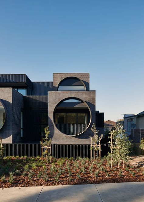 Circular windows dominate the staggered brick facades of this apartment block designed by Australian practice BKK Architects for Melbourne's Ivanhoe East. Circular Windows, Melbourne Apartment, Modern Residential Architecture, Porthole Window, Modern Architecture Design, Brick Facade, Building Facade, Facade Architecture, Roof Design