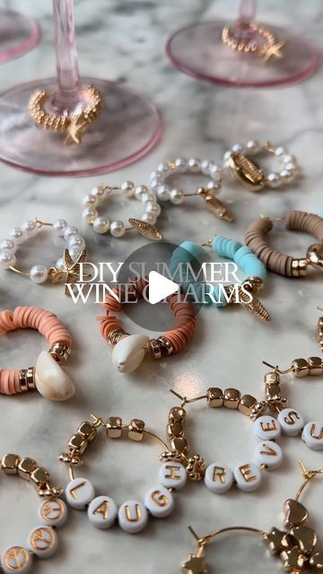 Erin Rae │ Hosting, Events, Dinner Parties, DIYs on Instagram: "This is your sign to make wine glass charms this summer!! 🍷☀️

Save this reel for later! ⬇️

I had left over beads from the coastal hat activity and wanted to make charms for all my glassware this summer. 

They are so easy to make and there are many different themes you can do with them. I bought the 60 pack of Wine Glass Charm Rings.

My favorite charm set is the coastal and summer vibes themed charms. 🐚☀️

These would make great gifts for birthdays, hosts, bachelorette parties or for new home owners. 

Follow @revexrae for more DIYs and hosting inspo 🤍

#wine #winecharms #diycrafts #giftideas #summertime #summerproject #dream #amazonfinds" Wine Glass Name Tags Diy, Bachelorette Dinner Themes, Bridal Shower Craft Ideas, Bridal Shower Activities Crafts, Diy Wine Glass Charms, Diy Wine Charms, Wine Glass Charms Diy, Wine Glass Decorating Ideas, Wine Charms Diy