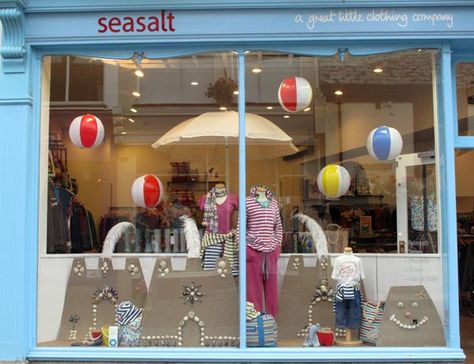 summer themed window display - Google Search Beach Ball Window Display, Beach Theme Window Display, Summer Window Display Store Fronts, Beach Window Display, Boutique Window Displays, Beach Window, Summer Window Display, Store Front Windows, Window Display Retail