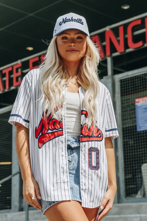 Introducing the brand new NASH Vintage Baseball Jersey! This unisex statement or layering piece is a must-have for any wardrobe. Made with lightweight material, it guarantees maximum comfort and breathability. The full button front and unisex pinstripe design make it a perfect addition to any outfit. Wear it open with cut offs, or closed! 100% polyester Relaxed Unisex Fit Baseball Game Outfit Jersey, Baseball Jersey Outfit Women, Jersey Outfit Women, Basketball Jersey Outfit, Vintage Baseball Jersey, Baseball Jersey Outfit, Baseball Jersey Women, Baseball Jersey Men, 2024 Outfits