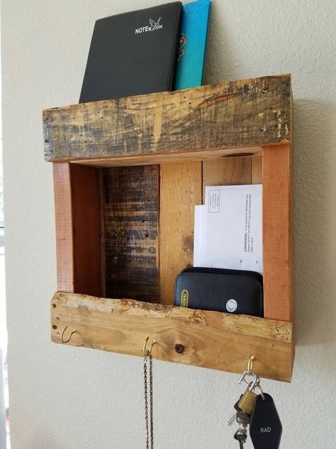 Repurposed/recovered pallet wood shelves, perfect for use in an entryway, hallway, bathroom, kids room, kitchen, foyer, patio, etc.   Good for indoor or outdoors! This wall-mounted piece includes two shelves and 3 gold decorative hooks for keys, hats, necklaces, or glasses.  It has been mostly left in it's natural state with only a light stain, and sealed to prevent flaking and to provide a smooth finish. The total dimensions of the shelf are 16 inches tall by 21 inches wide by 4 inches deep.  D Pine Shelf, Shelf Entryway, Pallet Wood Shelves, Small Pallet, Pallet Shelf, Rent House, Pine Shelves, Custom Bathroom Vanity, Pallet Ideas Easy