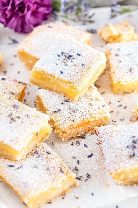 Lavender Lemon bars - A spring time, subtle floral twist on the classic sweet and tart dessert. Just add a little lavender extract and some lavender buds! From aberdeenskitchen.com #lavender #lemon #bars #baking #dessert #spring #recipe #sweet #tart Lavender Lemon Bars Recipe, Lemon Lavender Dessert Recipes, Beltane Dessert, Lemon Lavender Pie, Lemon Lavender Desserts, Lemon And Lavender Desserts, Lemon Lavender Tart, Desserts With Lavender, Lemon Lavender Recipes