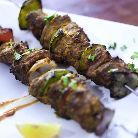 Smoky barbecued mutton bursting with classic subcontinental flavors. Tikka Boti Recipe, Beef Tikka, Hot Spices, Noodle Bar, Chicken Kebabs, Chili Paste, Red Chili Powder, Coriander Powder, Weird Food