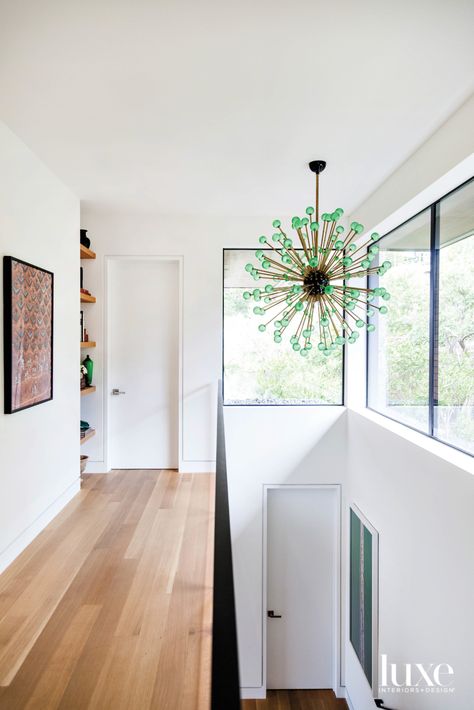 When the wife and designer Maja Lithander Smith found a “wow” vintage glass Sputnik light fixture, they were determined to find a place for it to live. It looks right at home over an interior stairway between the main and upstairs levels. Sputnik Light Fixture, Forest Mural, Custom Coffee Table, Vintage Light Fixtures, Architecture Home, Luxurious Home, Luxe Interiors, Home Tours, Dining Table Marble