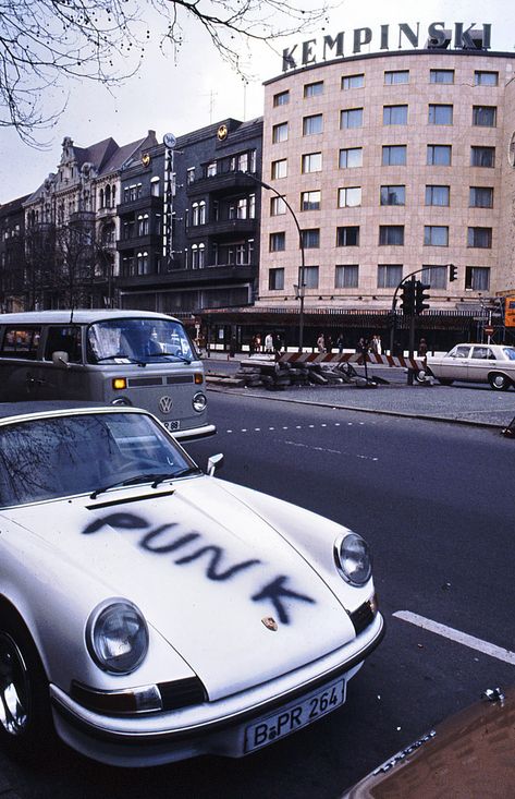 A Punk Porsche Opposite the Kempinksi Hotel in Berlin in the 80's and shot by Kurt Tauber. Not sure if this is the drivers own artwork but it is actually quite a good paint job in terms of the font and the spray work.⁠ ⁠ #porsche #punkporsche #berlin #punkberlin #kurttauber 1980s Aesthetic, Punk 80s, West East, West Berlin, East Berlin, Badass Aesthetic, 80s Aesthetic, The Secret History, Car Ride