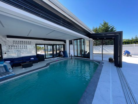 Indoor Pool Glass Roof, Partially Covered Pool, Pool With Retractable Roof, Outdoor Pool Enclosure, Sunroom Pool Ideas, Residential Indoor Pool, Indoor And Outdoor Pool, Retractable Pool Enclosures, Indoor Outdoor Pool House