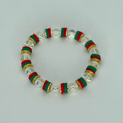 This is the perfect festive Christmas themed bracelet. It’s so much fun and can be worn alone or stacked with many other options Bracelets are “one size fits most” and are designed to fit wrists up to 7.0”. ﻿ *Bracelets usually ship within 3-5 business days. Please be aware that due to the unique and handmade nature of each product, color, shapes, and bead sizes may vary slightly from the photos and description. Clay Bead Bracelet Ideas Colorful, Preppy Christmas Clay Bead Bracelets, Preppy Christmas Bracelet Ideas, Cute Christmas Clay Bead Bracelets, Grinch Clay Bead Bracelets, Christmas Bead Bracelet Ideas, Cute Christmas Bracelets, Christmas Braclets Ideas, Clay Bead Bracelet Ideas Christmas