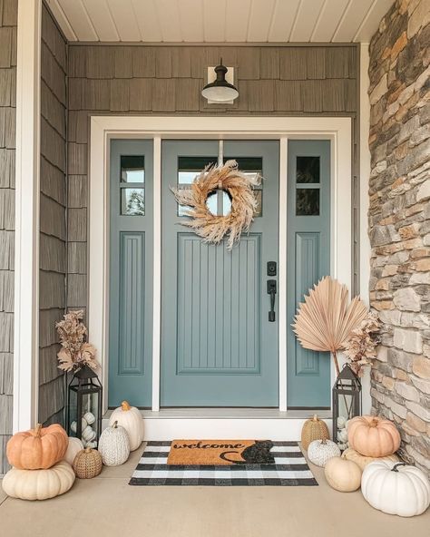 front door with different muted colored pumpkins, straw accents Farmhouse Fall Porch Decor, Farmhouse Fall Porch, Bohemian Farmhouse Decor, Spring Front Porch Decor, Black Modern Farmhouse, White Pumpkin Decor, Boho Fall Decor, Blue Front Door, Fall Porch Decor