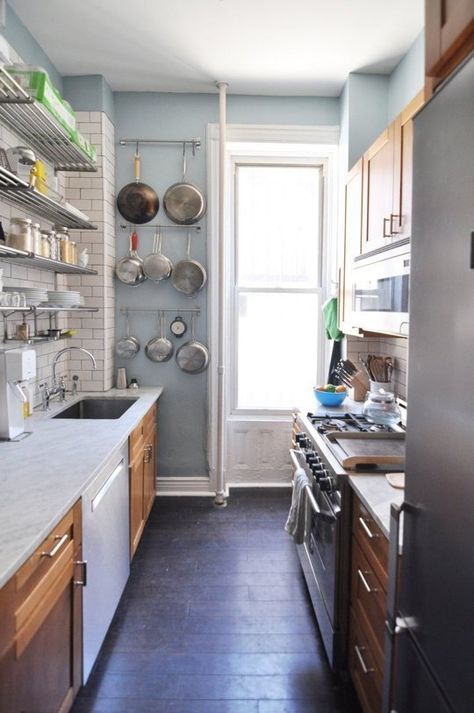 well arranged galley kitchen w/ mic of closed wood cabinets and open steel shelves, pans hanging on a narrow wall, would change the marble counter, maybe apaint the wood cabinets Galley Kitchen Remodel Ideas, Kitchen Spotlights, Brooklyn Kitchen, Small Galley Kitchen, Galley Kitchen Remodel, Galley Kitchens, Kitchen Stand, Small Kitchen Ideas, 아파트 인테리어