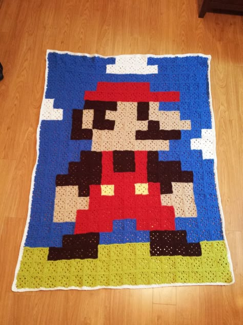 Mario Crocheted Blanket. Would be easy to do with any 8bit game. 8 Bit Crochet, Mario Blanket, Pixel Crochet Blanket, Mario Crochet, Crochet A Granny Square, Video Game Character, Crocheted Blanket, Pixel Crochet, Crochet Granny Square Blanket