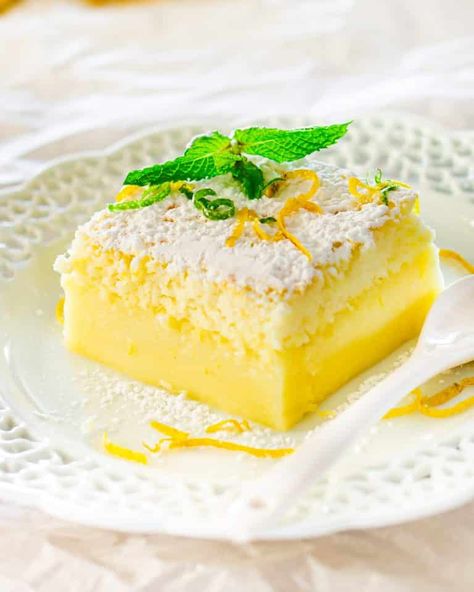 Lemon Magic Cake - one simple batter that turns into a 3 layer cake. Simply magical. The popular magic cake now in lemon flavor. #magiccake #lemonmagiccake #recipe Lemon Magic Cake Recipe, Lemon Magic, Magic Cake Recipes, Lemon Cakes, Torte Cupcake, Lemon Cake Recipe, Magic Cake, A Piece Of Cake, Lemon Desserts