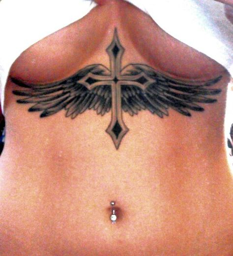 Cross & Wings Tattoo Woman Chest Tattoo Design, Cross On Stomach Tattoo, Cross On Chest Tattoo Woman, Cross Between Chest Tattoo, Cross With Wings Tattoo For Women, Wings Sternum Tattoo, Cross Sternum Tattoo Women, Cross With Wings Tattoo Designs, Cross On Back Tattoo