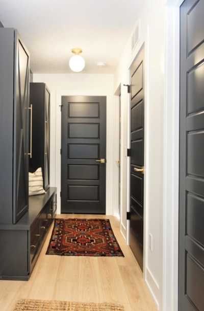 31 Black Interior Doors With White Trim Ideas - | Sebring Design Build Black Interior Doors Black Hardware, Dark Painted Interior Doors And Trim, Dark Door With White Trim, Black Interior Doors With White Trim Light Wood Floors, Matte Black Trim Interior, Interior Black Doors With Black Trim, House With Black Interior Doors, Black Interior Doors White Trim, White Trim Black Doors Interior