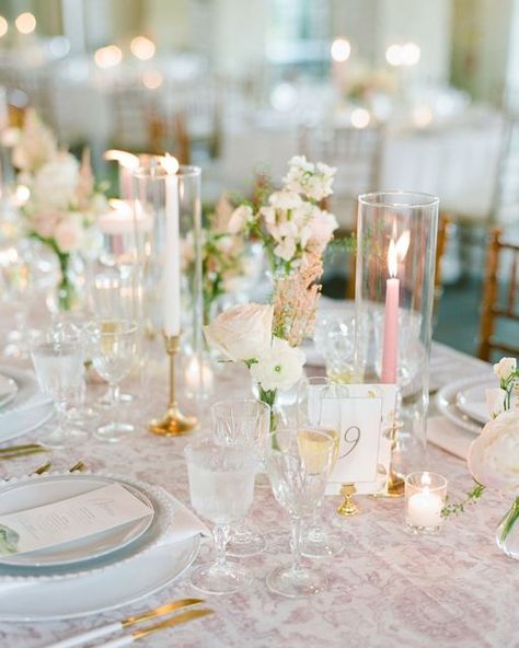 Aaron + Bethany Mallory on Instagram: "Getting ready to jump into our 2022 season and I can’t wait to see what all of our couples have chosen for their one-of-a-kind days ✨ Planning @laurelelise Florals @courtneyinghram Venue @earlymountain Scans @photovisionprints • • • • • ID: a close up shot of a table set with white plates, crystal stemware, lit taper candles, and blush and white florals all on top of a blush patterned table linen. // #themallorys #malloryweddings #film" Soft Pink Glam, Bud Vase Centerpiece, Blush Pink Wedding, Private Estate Wedding, Wedding Table Linens, Pink Glam, Crystal Stemware, Childhood Home, Blush Pink Weddings