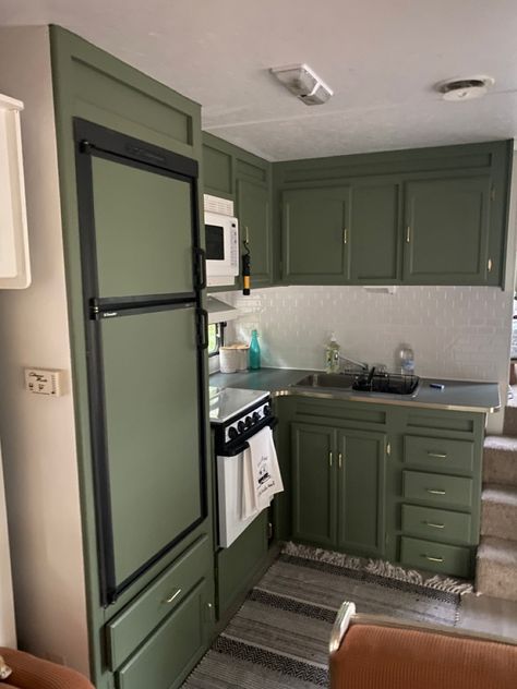 Trailer kitchen remodel with green cupboards Dark Green Camper Cabinets, Rv Remodel Green Cabinets, Rv Decorating Ideas Green, Green Cabinets Camper, Green Rv Kitchen, Green Rv Cabinets, Green Rv Interior, Dark Green Camper Interior, Sage Green Camper Interior