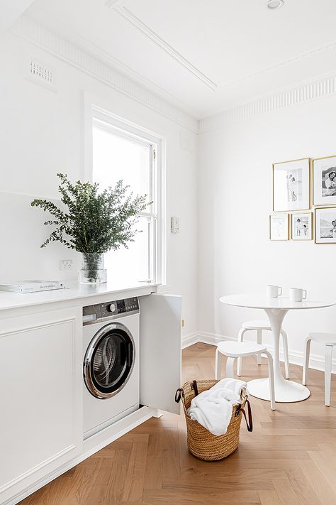 10 hidden laundry cabinet ideas that hide away the clutter | Hide Washing Machine, Laundry Cabinet Ideas, Long Pendant Lights, Laundry Cabinet, Laundry Chute, Hidden Laundry, Door Images, Shaker Style Cabinets, Laundry Cabinets