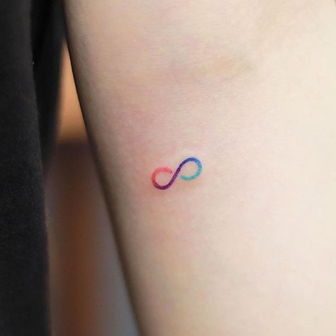 27 Unique Tiny Tattoos (Ideas, Designs & Meanings) Arm Tattoos For Women Colorful, Infinity Rainbow Tattoo, Small Color Tattoos For Women, Minimal Tattoos For Women With Meaning, Colorful Tiny Tattoos, Colored Small Tattoos, Minimal Tattoo Color, Tiny Colorful Tattoos, Small Colorful Tattoos For Women