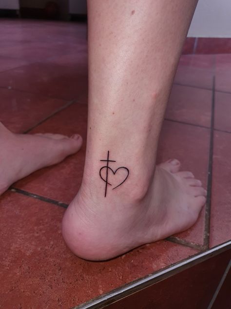 #crosstattoo #cross #heart #tattoo #small #women Cross With Red Heart Tattoo, Cross With Heart Tattoo On Wrist, Heart Ankle Tattoos For Women, Cross And Heart Tattoos For Women, Cross With Heart Tattoos For Women, Cross Ankle Tattoos For Women, Tattoo Cross For Women, Cross With Heart Tattoo, Heart With Cross Tattoo