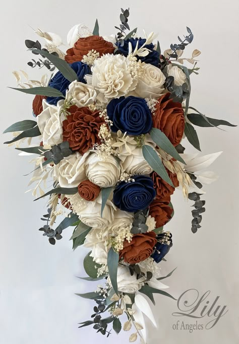 Model SBNV01 ABOUT THIS ITEM: This wedding flower package is made with natural Sola flowers, Rust (Burnt Orange), Navy and Ivory Roses, Mini Roses, Beli Flowers, Dried Baby's breath, Faux Greenery and Faux Berries. The handle is decorated with Ivory ribbon. Bride's bouquet shown in 1st picture is Cascade 9-10" by 17-18". Bride's bouquet shown in 2nd picture is the 10" size. Only bride bouquet is cascade in this model, Other bouquets are all round (not cascade). ABOUT SOLA FLOWERS: Sola wood flow Wedding Bouquet Cascade, Navy Wedding Bouquet, Bouquet Cascade, Cascade Bridal Bouquet, Flower Fall, Rusting Wedding, Cascading Bridal Bouquets, Cascading Wedding Bouquets, Burnt Orange Weddings