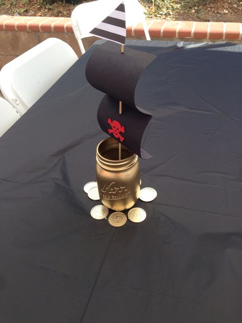 DIY centerpieces pirate Diy Pirate Centerpieces, Pirate Birthday Centerpieces, Pirates Centerpieces Ideas, Pirate Theme Decorations Diy, Pirate Party Centerpieces Diy, Pirate Theme Centerpieces, Pirate Gender Reveal Ideas, Diy Pirate Party Decorations, Pirate Centerpiece Ideas