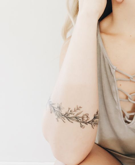 Floral arm tattoo. Dainty Ring Flower Tattoo, Dainty Cuff Tattoo, Wreath Arm Tattoo, Floral Arm Band Tattoo For Women, Floral Arm Cuff Tattoo, Arm Tattoo Dainty, Floral Cuff Tattoo, Arm Cuff Tattoo, Tattoo Dainty