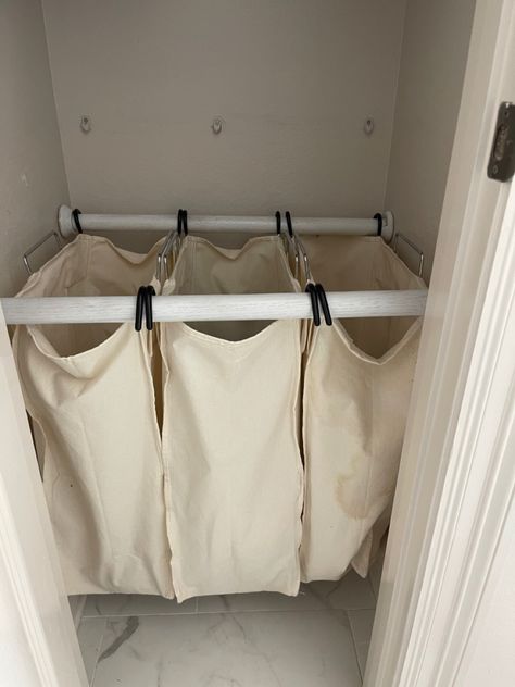 I took these laundry bags from a metal laundry cart. I used closet wooden rods and wall attachments to have a hidden laundry hamper in the linen closet in the master bathroom. Hanging Laundry Bag Diy, Hamper Closet, Hanging Laundry Basket, Bathroom Laundry Hamper Ideas, Linen Closet With Laundry Hamper, Laundry Solutions For Small Spaces, Laundry Hamper In Closet, Laundry Hampers Ideas, Diy Laundry Bag Hanging