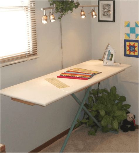 The extension built of wood fits securely over your existing ironing board. According to the designer, Diana Beaubien of Pleasant Valley Creations, the weight of it will stabilize an ironing board that’s a bit wobbly. Plus, you can remove it easily and store it should you need to do so. To make this you’ll need some experience with a drill, screwdriver and staple gun. A lumberyard or home supply store, like Lowe’s or Home Depot, will cut the wood to size for you. The pattern also includes in... Quilters Ironing Board, Ironing Station, Sewing Room Design, Ironing Board Covers, Sewing Room Organization, Quilting Room, My Sewing Room, Sewing Rooms, Ironing Board