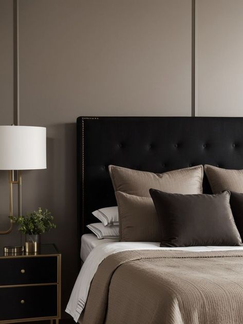 Create a stylish and sophisticated bedroom by painting one wall in a dark taupe shade. Pair it with a tufted upholstered headboard, sleek black nightstands, and metallic accents for a modern and luxurious look. Taupe Accent Wall, Black Nightstands, Taupe Bedroom, Taupe Walls, Black Nightstand, Sophisticated Bedroom, Tufted Upholstered Headboard, Black Headboard, Luxury Bedroom