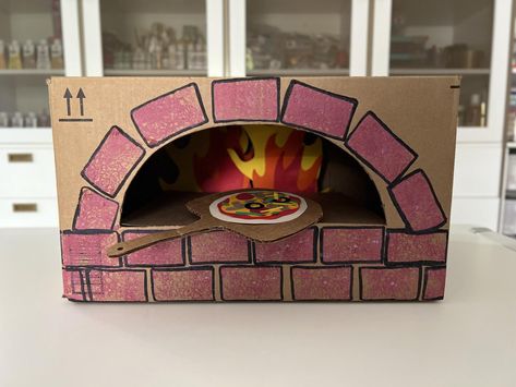 DIY Cardboard Pizza Oven For Kids | Rachael Ray Show Diy Play Pizza Oven, Cardboard Pizza Craft, Pizza Diy Craft, Pizza Crafts For Kids, Cardboard Pizza Oven, Surprise Pizza, Dramatic Play Diy, Kids Oven, Diy Oven