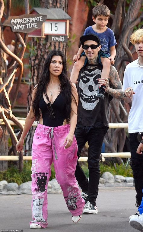 Kourtney Kardashian enjoys day out at Disneyland with beau Travis Barker and their kids | Daily Mail Online Kourtney Barker Style, Kardashian Disneyland Outfits, Celebrity Disneyland Outfits, Disneyland Street Style, Kourtney Kardashian Disneyland Outfit, Travis Barker Outfit, Travis Barker 90s, Kourtney Kardashian Disney, Kourtney Kardashian Style Travis Barker