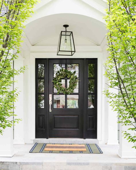 Ready to get inspired? Click through to see what our experts recommend you do right now if you're looking to boost your home's curb appeal. And if you're seeking more ways to amp up your home's exteriors, check out these beautiful landscaping ideas, plus festive ways to deck out your front porch this summer. #marthastewart #decorideas #diydecor Colonial Front Door With Sidelights, Front Door On White House, Mcgee Exterior, Front Entryway Ideas Exterior, Exterior Front Door Ideas, Exterior Entryway Ideas, Front Door Ideas, Front Door Inspiration, Beautiful Landscaping