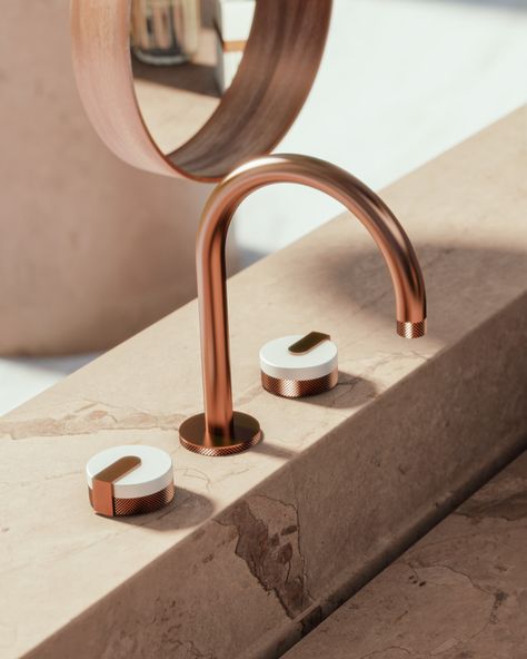 The MOD+ Collection, aglow in a Rose Gold finish with Architectural White inserts, appears to rise like a flame warming the pink marble of a luxuriant bath space. #BathroomInspo #DesignInspo #LuxuryBathroom #ModernHome #InteriorDesignIdeas #GRAFFDesigns #ArtofBath Gold Bathroom Fixtures, Rose Gold Bathroom, Toilet Ideas, Gold Taps, Gold Fixtures, Public Restroom, Rose Gold Accents, Gold Bathroom, The Mod