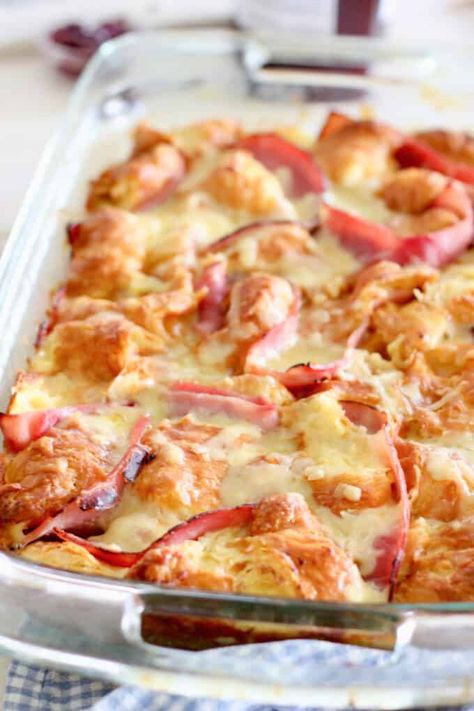 Tender and delicious Croissant Breakfast Casserole!  Store bought baked croissants, deli ham, gruyere cheese (or sub swiss) and an easy to make custard of eggs and half and half! Stuffed Croissant French Toast Casserole, Cheesy Ham And Gouda Croissant Casserole, Ham Egg And Cheese Croissant Breakfast, Croissants Breakfast Casserole, Bacon And Cheese Croissant, Ham Swiss Croissant Bake, Ham And Croissant Breakfast Casserole, Crossiant Casserole Recipes, Ham And Cheese Croissant Breakfast Casserole