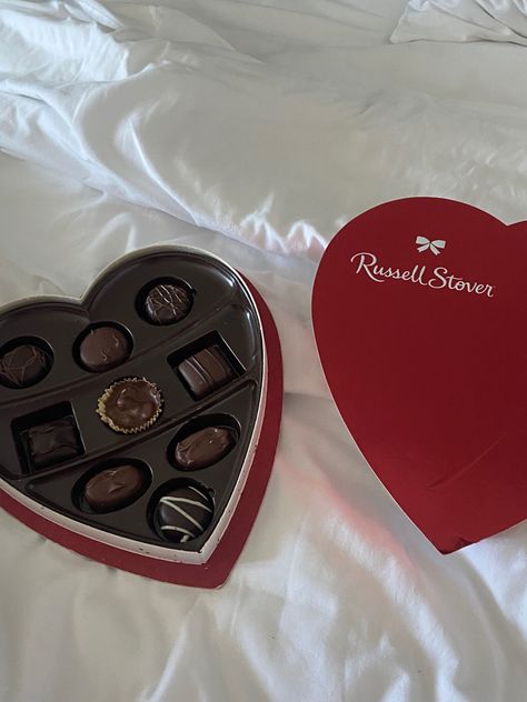 red heart shaped chocolate box on a white blanket Heart Shaped Box Of Chocolates, Heart Shaped Box Aesthetic, Box Of Chocolates Aesthetic, Heart Box Of Chocolates, Valentines Day Chocolates, Box Of Chocolates, Heart Shape Box, Heart Box, Chocolate Hearts