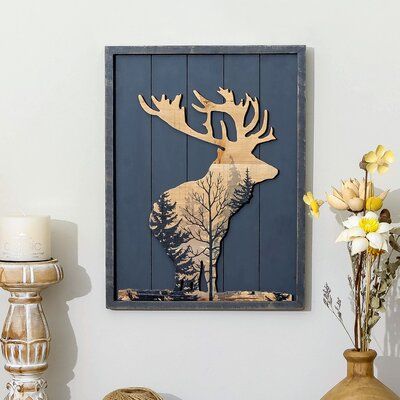 Add a dazzling wildlife touch to your home with this Forest Moose Wood Wall Decor. This rustic wood framed wall piece features a looking back moose silhouette with a natural color and black forest print on a gray wood plank background. Hang it up with other nature-inspired pieces for a fantastic look! | Millwood Pines Forest Moose Wood Wall Decor in Brown/Gray/Red, Size 15.75 H x 11.81 W x 0.98 D in | Wayfair | Home Decor Moose Paddle Decor, Rustic House Kitchen, Lodge Wall Decor, Moose Silhouette, Rustic Wood Crafts, Wood Pictures, Woodsy Decor, Cabin Wall Art, Cottage Wall Decor