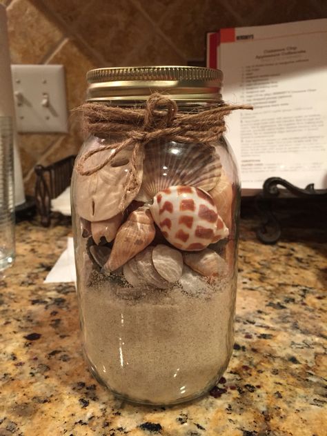 Seashells in Mason Jar Seashells In A Jar, Sand And Shells In A Jar Ideas, Beach Memory Jars, Seashell Jar, Beach In A Jar, Shell Jar, Beach Mason Jars, Beach Jar, Shell Centerpieces