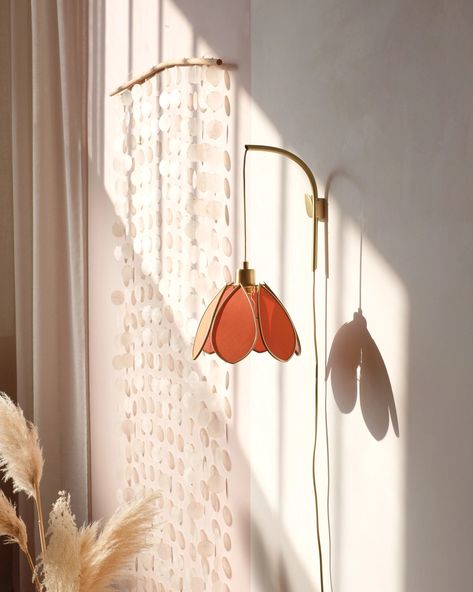 We offer you an elegant and graceful wall support to install your flower lamps. The support is sold with our small flower lampshade, covered with an ocher colored fabric. We designed this support by imagining a minimalist and very easy to use fixing system, to highlight our small lampshades flowers. It is made in Portugal, in brushed brass. It attaches to the wall with two screws. The electric cord can be adjusted according to your need, you can let it fall forward as you like. An installation g Wall Lighting Flower, Hanging Lamp Decor, Eclectic Wall Lamps, Ceiling Lights For Hallway, Apartment Friendly Lighting, Flower Wall Light, Flower Wall Lamp, Sconces Above Couch, Hanging Lights In Living Room