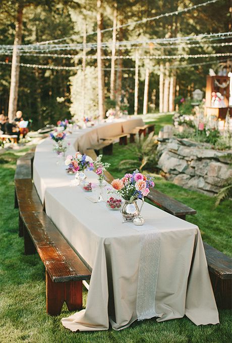 Long Banquet Wedding Tables: Spring Flowers and Ribbon  | Brides.com Casual Wedding Reception Seating, Picnic Bench Wedding Tables, Decorated Picnic Tables, Casual Seating Wedding, Wedding Banquet Tables, Casual Backyard Wedding Reception, Picnic Style Wedding, Casual Backyard Wedding, Casual Reception