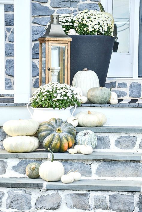 A white-out of pumpkins creates a pretty and attention grabbing fall front porch. Get tips to create pretty outdoor fall decorating #fall #falldecor #pumpkins #autumnideas #falldiy #fallporch #whitepumpkins #mums #stonegable Pumpkin Porch Decor, Fall Landscaping, Mums In Pumpkins, White Mums, Porch Pumpkins, Wedding Entrance Decor, Lantern Ideas, Blue Pumpkins, Autumn Decorating