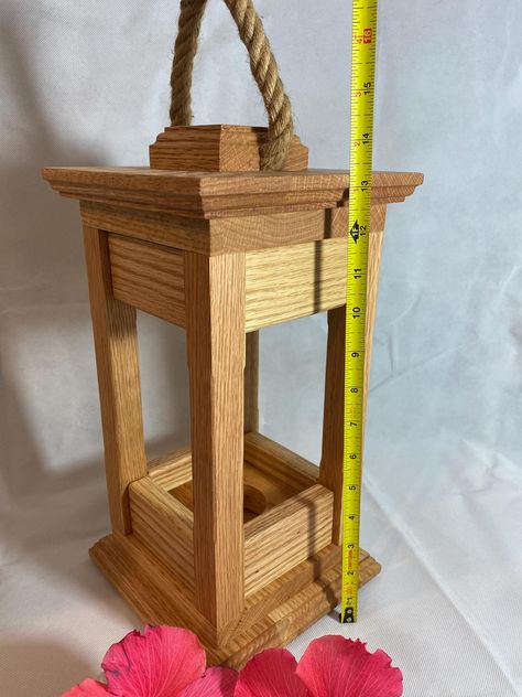 Handmade, solid oak lantern candle holders in 3 sizes, 14" - 16" - 18" tall.  Finished with Osmo Polyx Oil Natural and Eco friendly clear finish.  All 3 sizes are 7-1/4" wide at the widest point of the tops and bottoms.  Each lantern comes with 4 rubber feet on the underside and have a 1/2" thick jute rope handle.   Weights: 14" Lantern weighs 5 lbs 9 oz 16" Lantern weighs 5 lbs 14 oz 18" Lantern weighs 6 lbs 2 oz The bases can accept 3" diameter candles and also come with a ring insert to hold Wood Lighting Design, Candle Holder Wedding, Lantern Candle Holder, Wood Projects Plans, Lantern Candle, Homemade Home Decor, Solar Lantern, Wood Lantern, Centerpiece Table