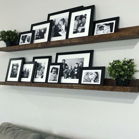 Floating Shelves Photo Wall, Frames On Floating Shelves, Shelf Frames Ideas, Long Shelf With Pictures, Floating Shelves For Picture Frames, Floating Shelves With Framed Pictures, Family Photo Wall Ledge, Black Frame Wall Gallery, Photo Wall Collage With Shelves