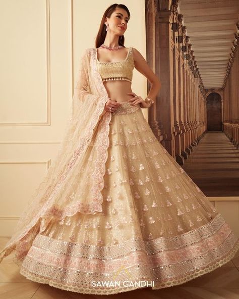 SAWAN GANDHI on Instagram: "I N A A Y A Seen here: Gold sequins net lehnga with pink bootis all over paired with sequins blouse and net duppatta. ιηααуα is Sawan Gandhi’s Festive ‘22 collection - a reflection of rich, handcrafted experience in the world of couture. A collection comprising heavy yet fuss free lehenga sets, cocktail sarees, sherwanis and kurta sets, ιηααуα embodies style and sensibilities. Collection available exclusively at our Mehrauli store and website, www.sawangandhi.com Sawan Gandhi, Cocktail Sarees, Rakhi Special, Sequins Blouse, Indian Couture, Desi Girl, Ikkat Saree, Gold Sequins, Photoshoot Poses